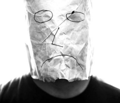 Gray_paper_bag_with_sad_smiley_over_head