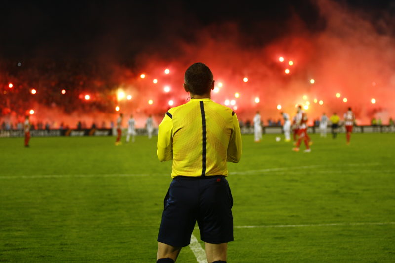 SERBIA, BELGRADE - APRIL 27, 2014: The referee during the match. Eternal rivals have met 146th times in the Eternal soccer derby, FC Partizan and Red Star from Belgrade, Partizan won in this match, was played on 27 April in Belgrade.