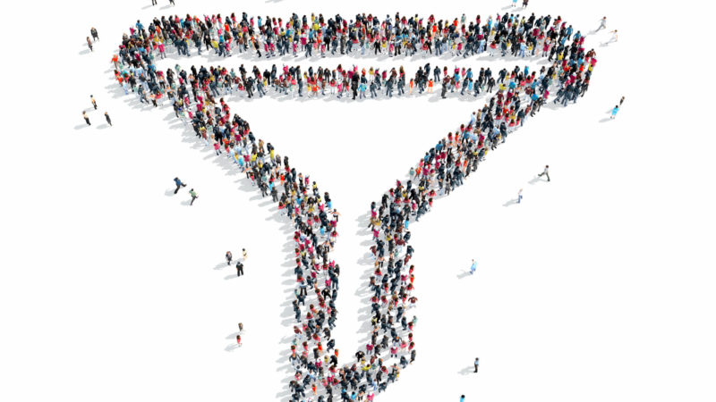 Overhead shot of crowd shaped like a funnel