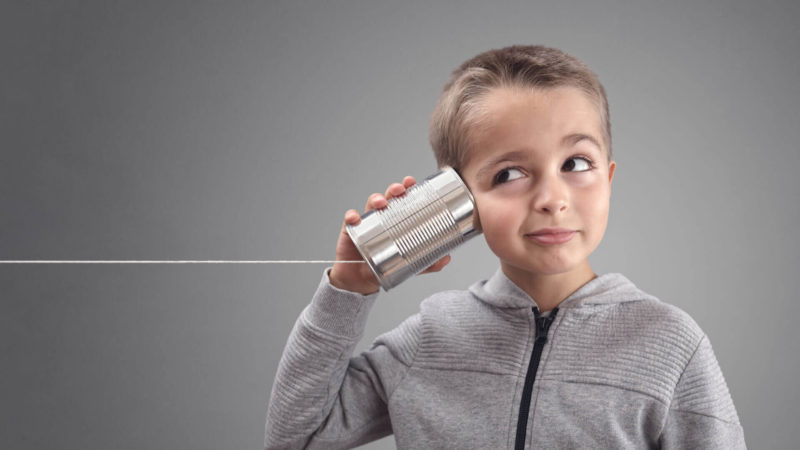 Child Listening Tin Can Phone Shutterstock 744297028