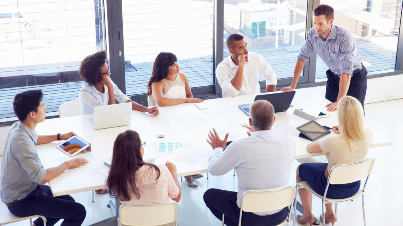 agency members meeting around table