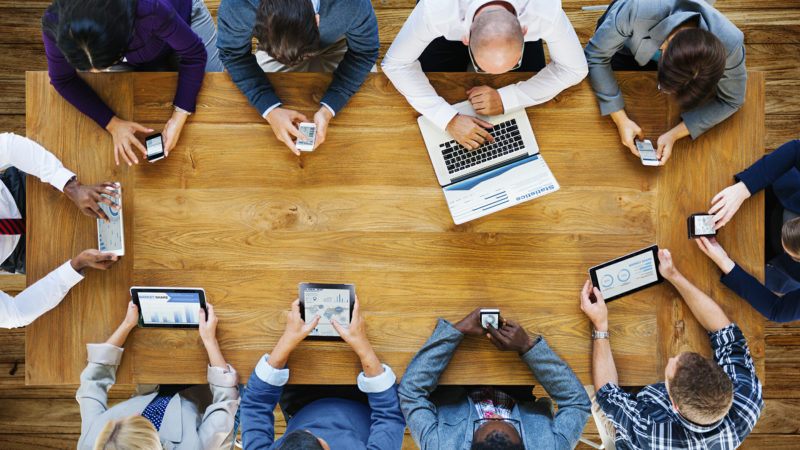 Meeting with everyone using laptops or phones