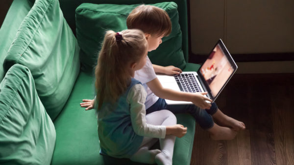 children-watching-Youtube-on-laptop-stock