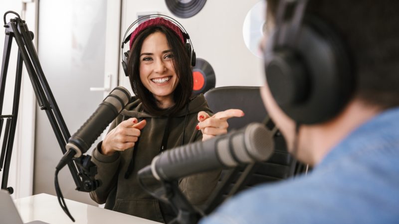 Two people in podcast studio