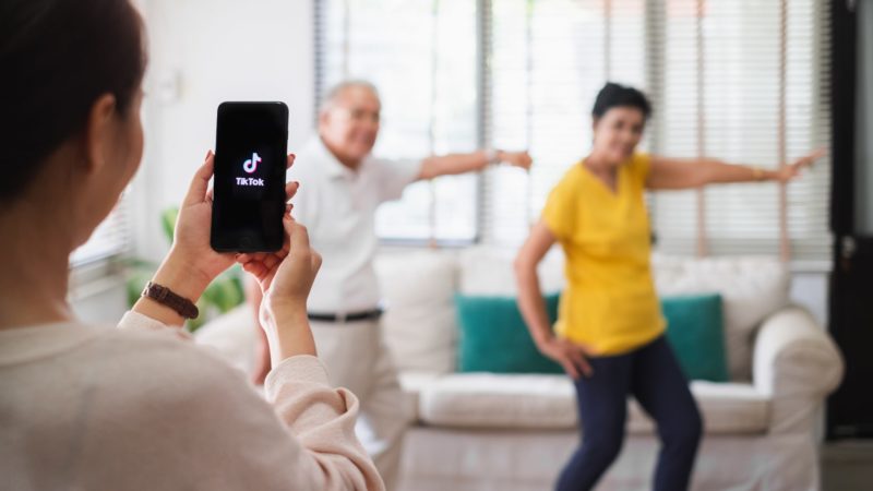 Older couple making a TikTok video