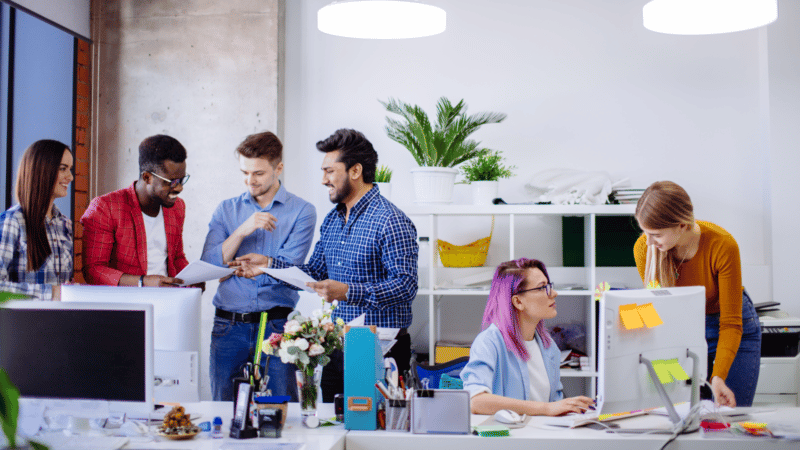 Agency marketers talking in office