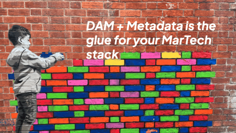 Little boy building colorful brick wall (martech stack)
