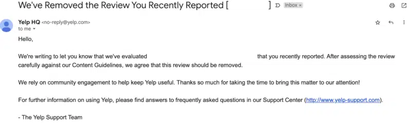 Yelp's follow-up email on a reported review, resulting in the removal of the content.