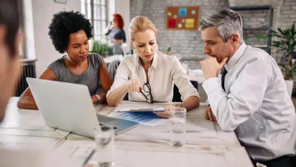 Group-of-business-people-going-through-business-plans