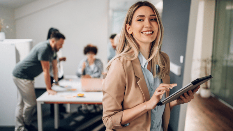 Young professional with colleagues in the background