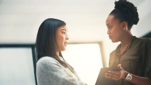 Cropped-shot-of-two-young-creatives-having-a-discussion-in-an-office