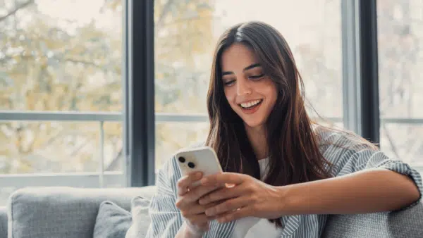 Woman-holding-smartphone-checking-email-or-SMS