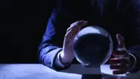 Businessman-using-crystal-ball-to-predict-future