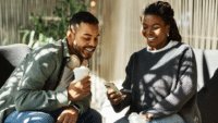 A-joyful-couple-engages-in-conversation-over-coffee-