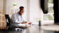 Man-listening-in-on-webinar