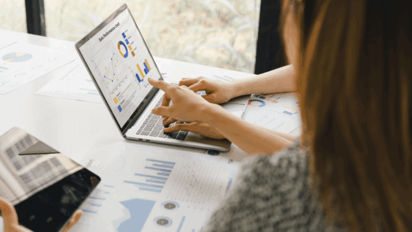 Two-colleagues-analyzing-financial-data-reports