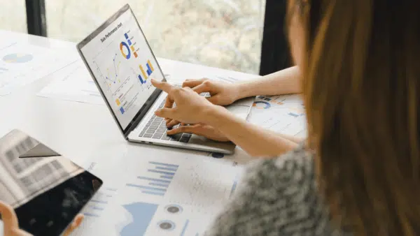 Two-colleagues-analyzing-financial-data-reports