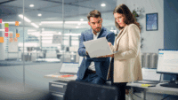 Young-Manager-Talking-with-Experienced-Colleague