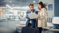 Young-Manager-Talking-with-Experienced-Colleague