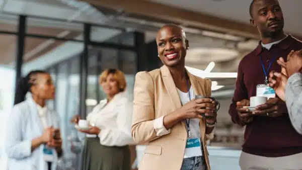 Cheerful-business-professionals-engaging-during-a-conference