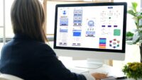 Website-designer-working-on-mobile-site-UI